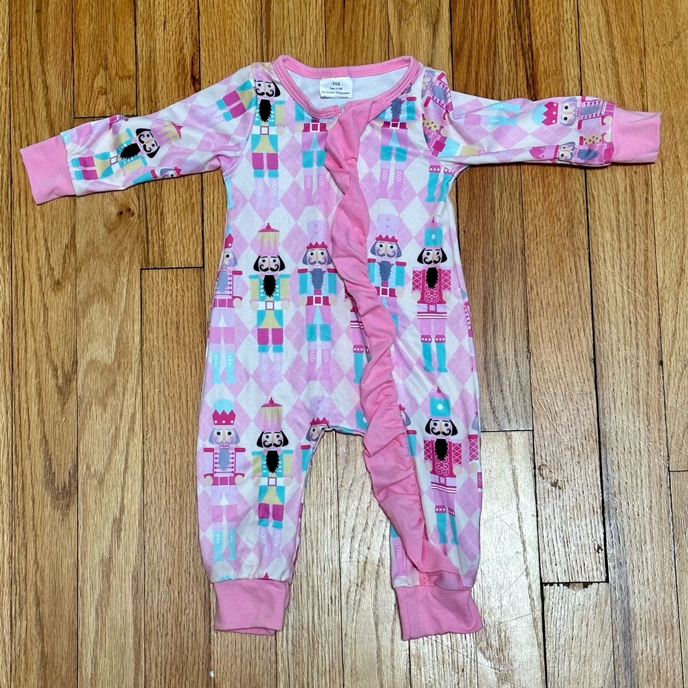 Pink Ruffle Nutcracker Zipper Onesie. Holiday Christmas pajamas